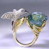 Anel Ajustável em Cor de Água-Marinha com Colibri – Banho de Ouro 14K